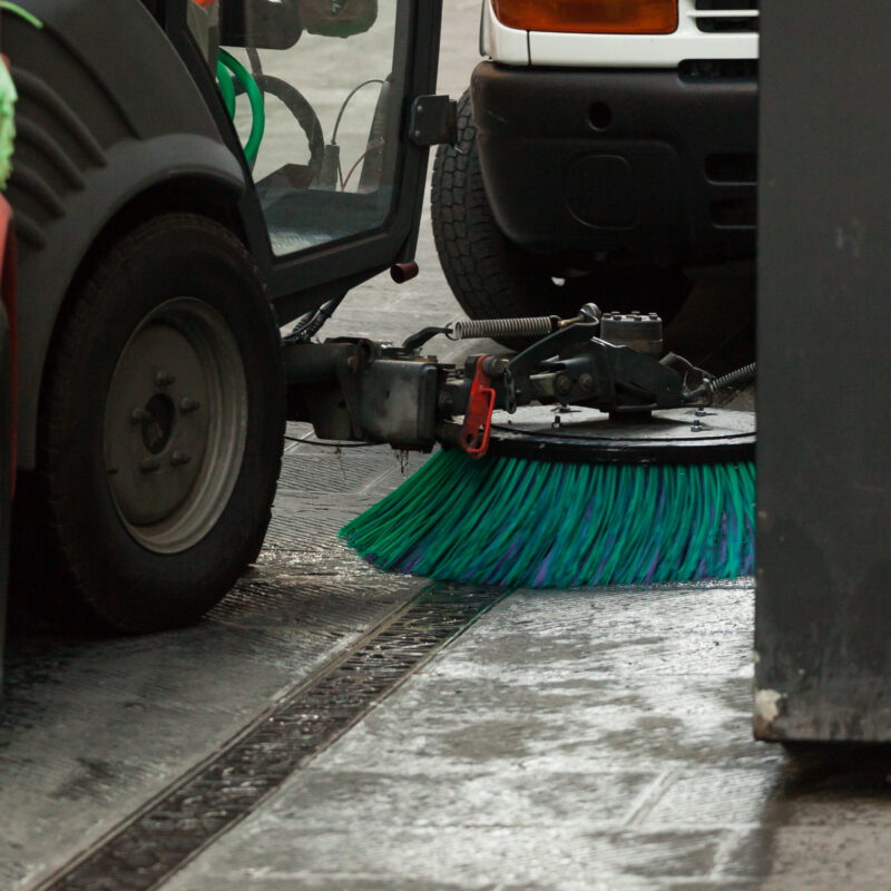 A street sweeper machine cleaning the streets.
